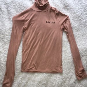 Long Sleeved Turtle Neck Top.